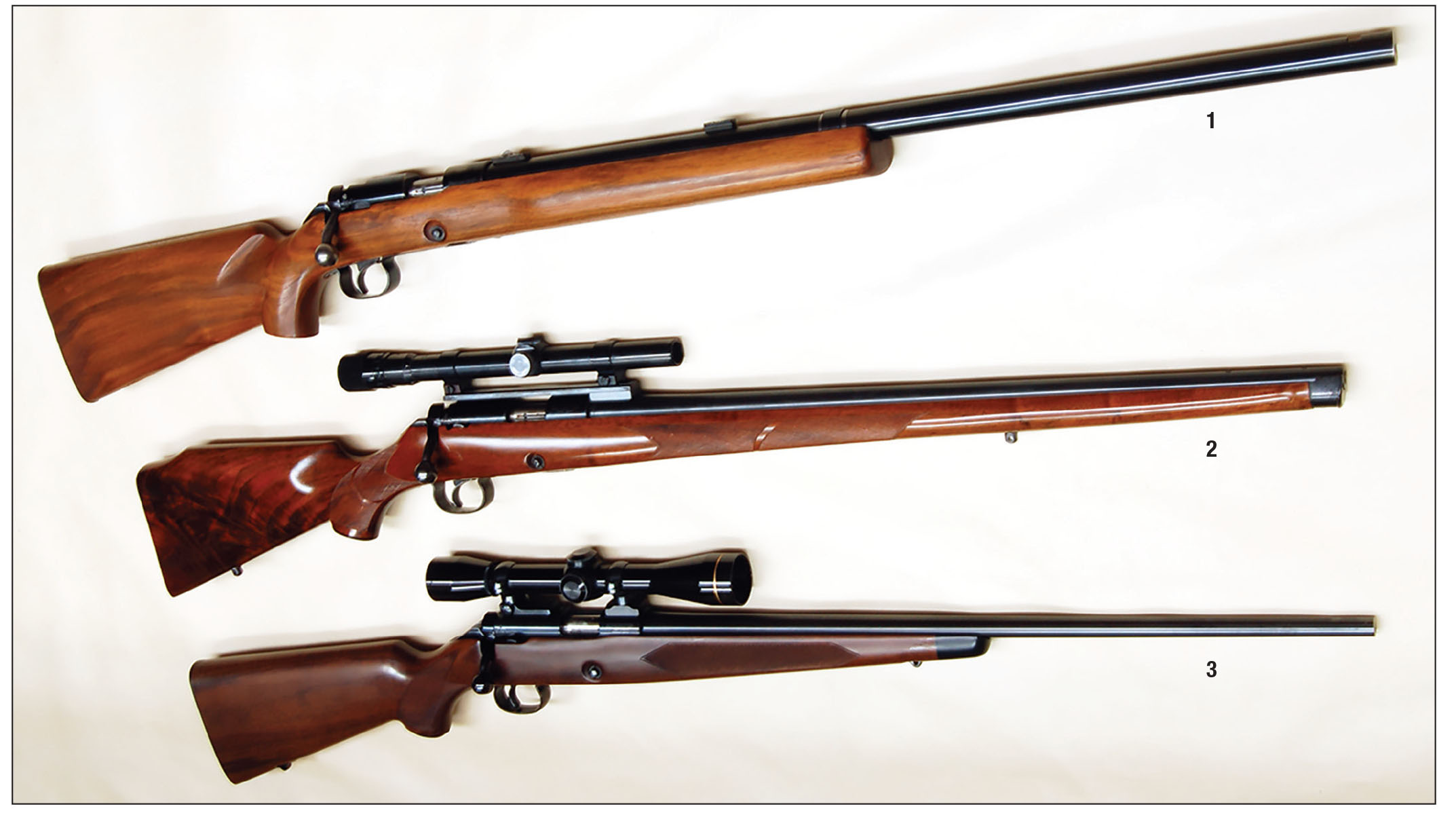 Three classic Model 52s: (1) A heavy barrel target, (2) a sporter built from a target rifle by an Iowa gunsmith and (3) a Winchester Sporter.